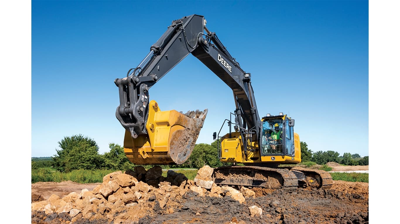 A 345P-Tier Excavator moving rocks and dirt at a worksite. | 4re Equipment | ID: 345PEXFT4