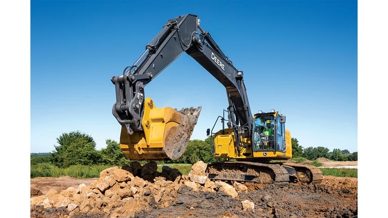 A 345P-Tier Excavator moving rocks and dirt at a worksite. | 4re Equipment